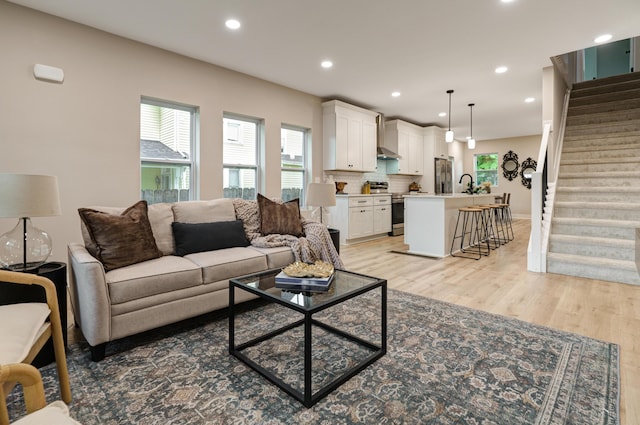 2587 Dayton Ave, Columbus, OH 43202 - living area with stairway, recessed lighting, and light wood-style flooring