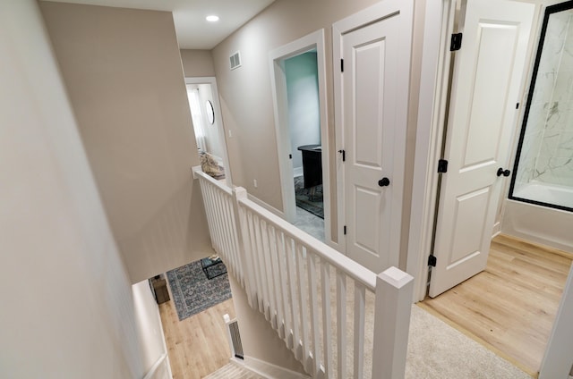 2587 Dayton Ave, Columbus, OH 43202 - staircase with wood finished floors and recessed lighting