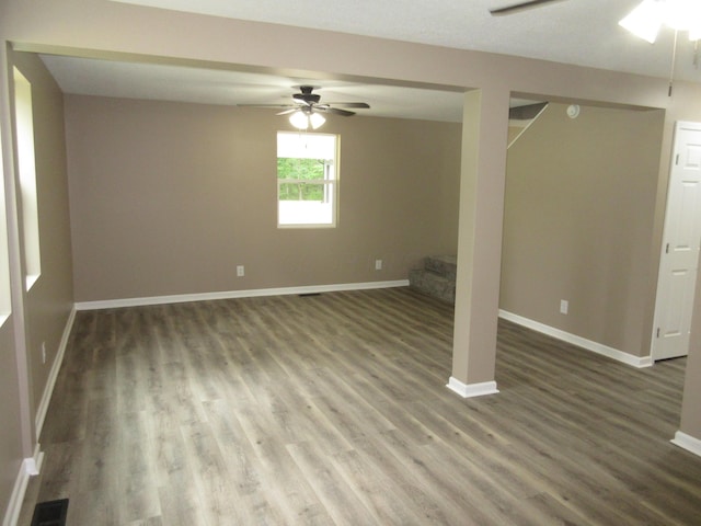 3814 London Hollow Rd NE, Newark, OH 43055 - basement featuring a ceiling fan, wood finished floors, baseboards, and stairs