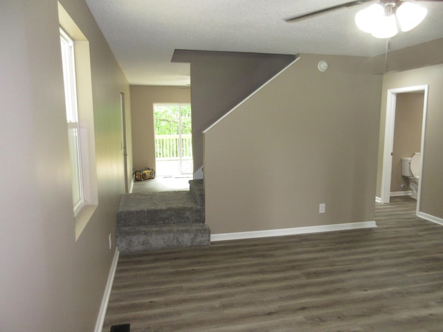 3814 London Hollow Rd NE, Newark, OH 43055 - stairs with wood finished floors, ceiling fan, and baseboards