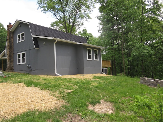 3814 London Hollow Rd NE, Newark, OH 43055 - back of property featuring a chimney, a shingled roof, and central AC