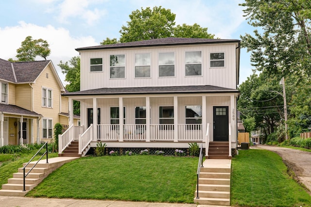 2589 Dayton Ave, Columbus, OH 43202 - view of front of home with covered porch, stairs, and a shingled roof