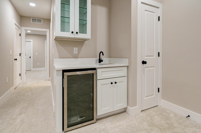2589 Dayton Ave, Columbus, OH 43202 - indoor wet bar featuring beverage cooler, light carpet, baseboards, and recessed lighting