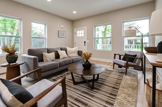 2589 Dayton Ave, Columbus, OH 43202 - living area with wood finished floors, plenty of natural light, recessed lighting, and baseboards