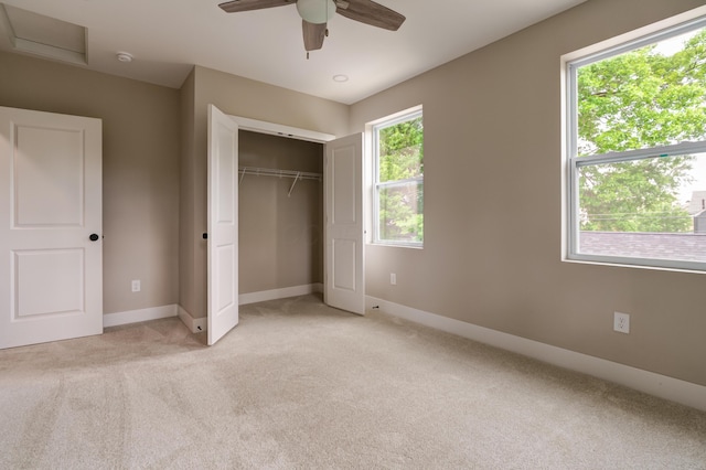 2589 Dayton Ave, Columbus, OH 43202 - unfurnished bedroom with light colored carpet, baseboards, a closet, and a ceiling fan