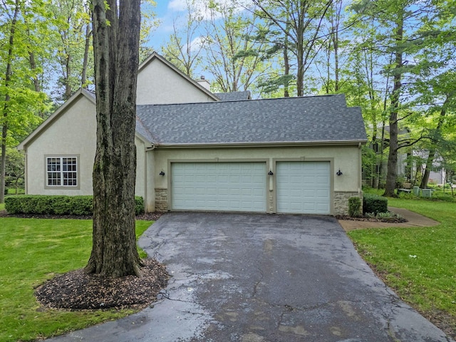 364 Morgan Ln, Columbus, OH 43230 - view of front facade featuring stone siding, stucco siding, driveway, and roof with shingles