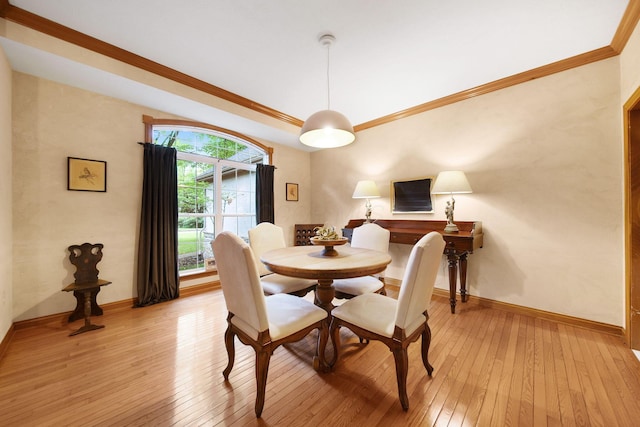 364 Morgan Ln, Columbus, OH 43230 - dining space featuring light wood-style flooring, baseboards, and ornamental molding