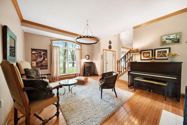 364 Morgan Ln, Columbus, OH 43230 - living area featuring stairway, wood-type flooring, crown molding, and baseboards