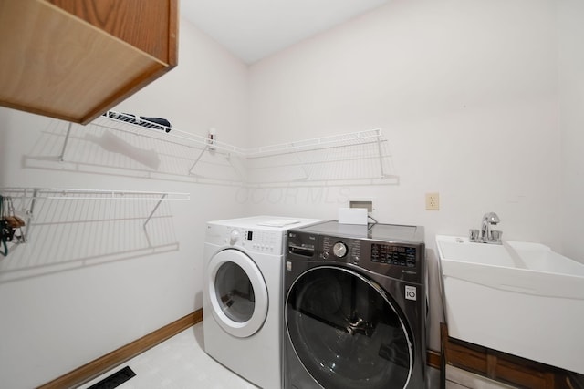 364 Morgan Ln, Columbus, OH 43230 - laundry area featuring washer and dryer and baseboards