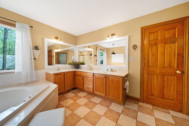 364 Morgan Ln, Columbus, OH 43230 - bathroom with plenty of natural light, a bath, double vanity, and tile patterned floors