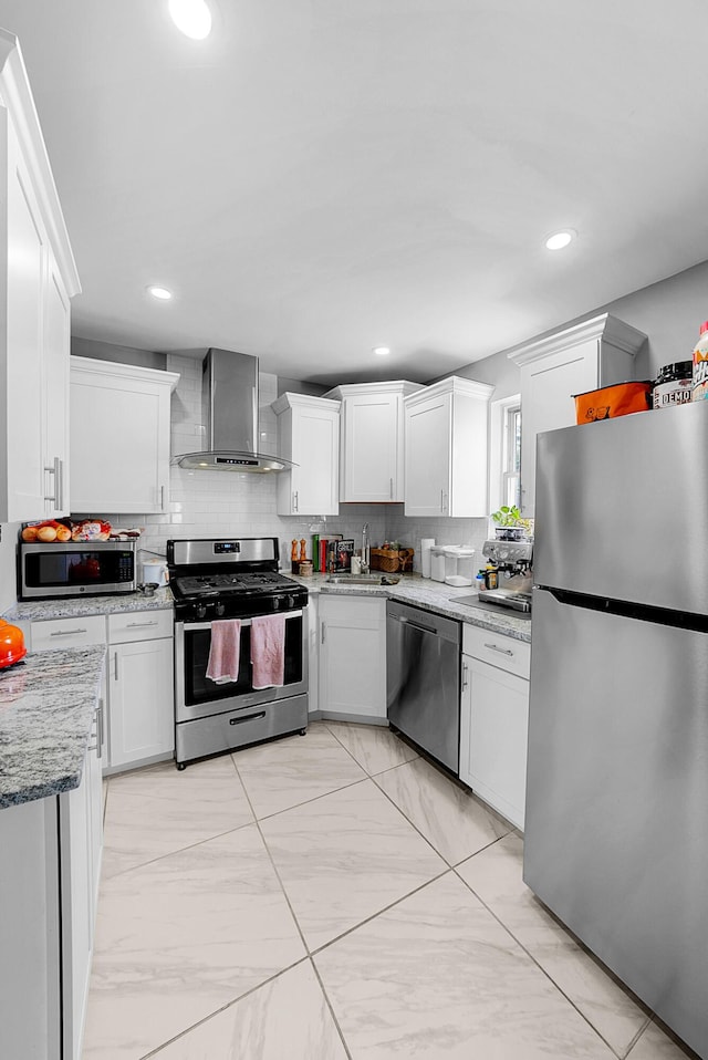 1081 Harrisburg Pike, Columbus, OH 43223 - kitchen featuring appliances with stainless steel finishes, wall chimney exhaust hood, a sink, backsplash, and recessed lighting