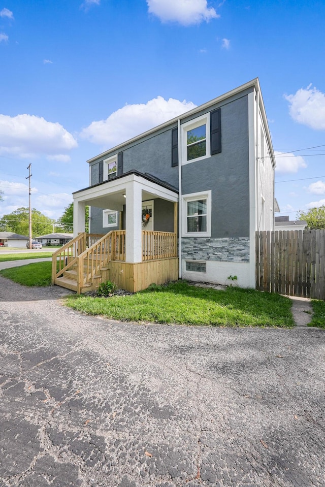 1081 Harrisburg Pike, Columbus, OH 43223 - view of front facade with covered porch and stucco siding