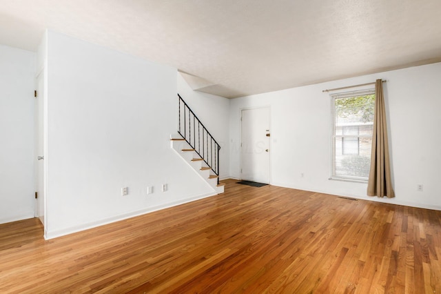 1824 Willoway Cir S, Columbus, OH 43220 - unfurnished living room with stairway and light wood finished floors