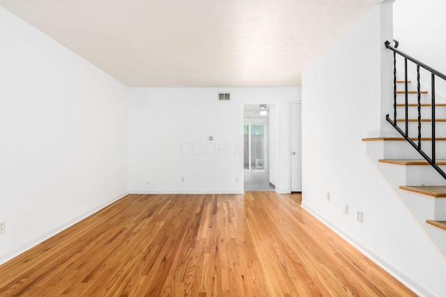 1824 Willoway Cir S, Columbus, OH 43220 - empty room with wood finished floors, stairs, baseboards, and ceiling fan