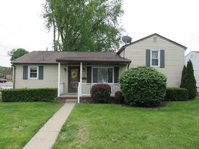 302 W Hubert Ave, Lancaster, OH 43130 - tri-level home featuring a porch, a front lawn, and a shingled roof