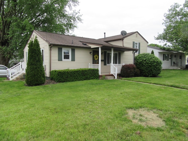302 W Hubert Ave, Lancaster, OH 43130 - view of front of home featuring covered porch, a front yard, and roof with shingles