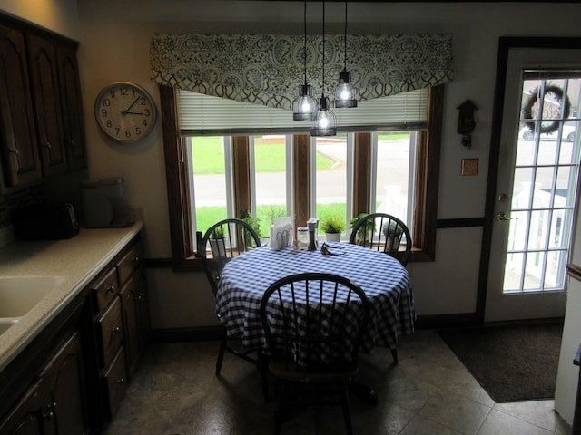 302 W Hubert Ave, Lancaster, OH 43130 - tiled dining space featuring baseboards and plenty of natural light