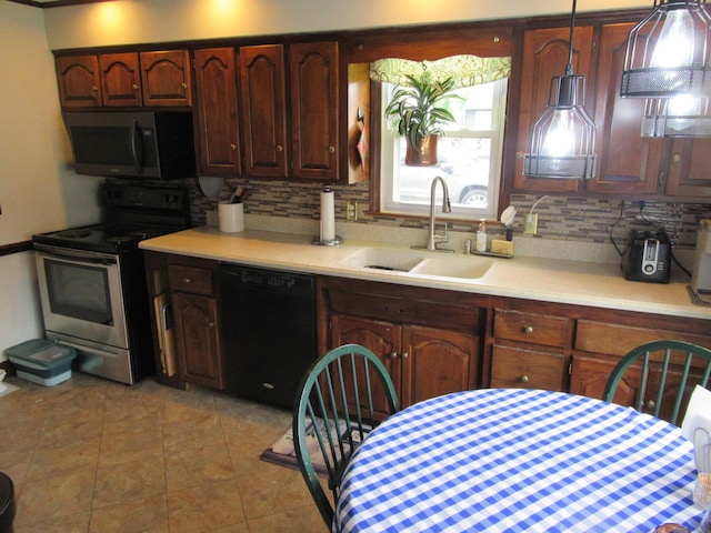 302 W Hubert Ave, Lancaster, OH 43130 - kitchen with stainless steel appliances, a sink, light countertops, and tasteful backsplash