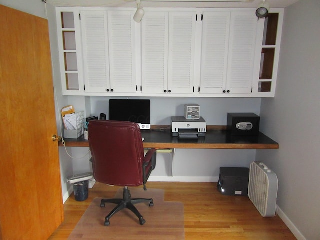 302 W Hubert Ave, Lancaster, OH 43130 - office space with built in desk, baseboards, and light wood-style floors