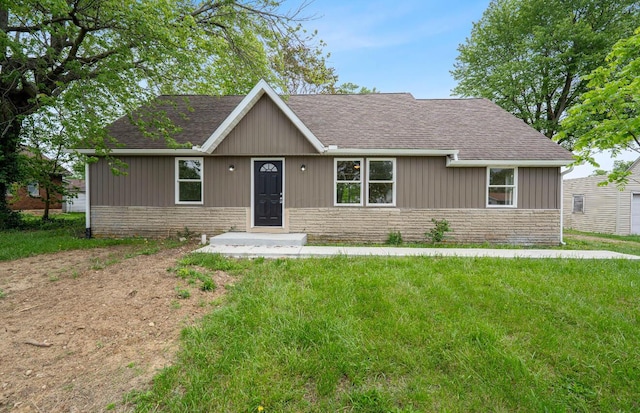 202 Toland St, London, OH 43140 - single story home featuring a front lawn, roof with shingles, and stone siding