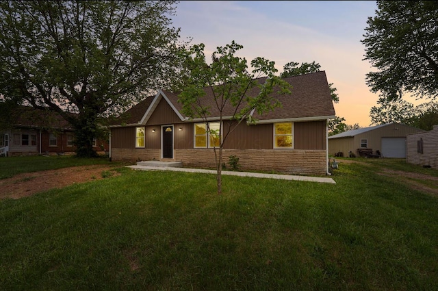 202 Toland St, London, OH 43140 - single story home featuring roof with shingles, a garage, a yard, and stone siding