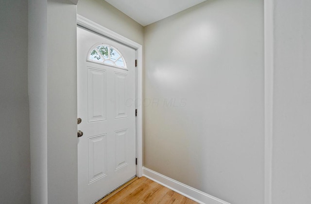 202 Toland St, London, OH 43140 - doorway featuring light wood-style flooring and baseboards