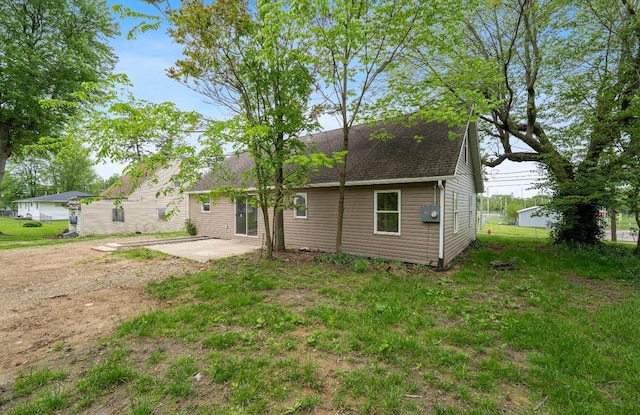 202 Toland St, London, OH 43140 - back of property featuring a patio and a shingled roof