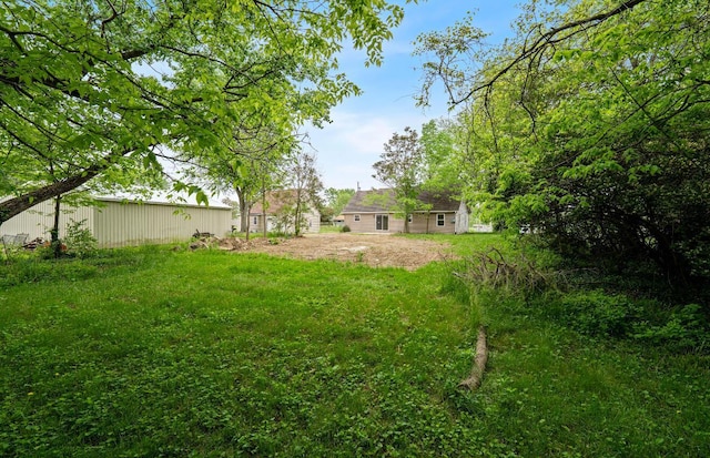 202 Toland St, London, OH 43140 - view of yard featuring an outdoor structure and an outbuilding