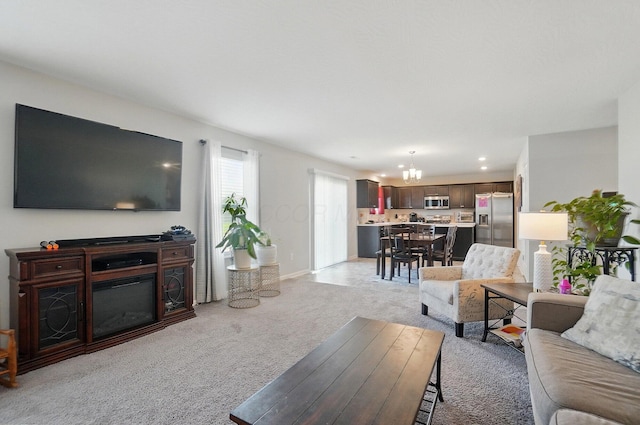 5416 Branchville Dr, Canal Winchester, OH 43110 - living area with a chandelier, light carpet, recessed lighting, and baseboards