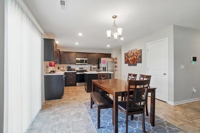 5416 Branchville Dr, Canal Winchester, OH 43110 - dining space featuring a chandelier, recessed lighting, and baseboards