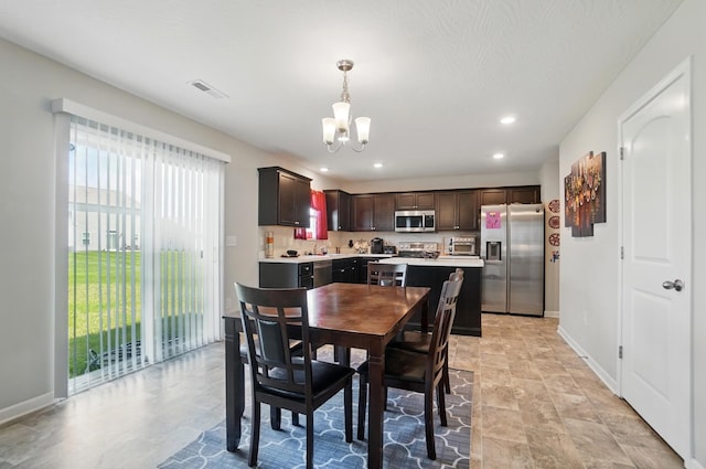 5416 Branchville Dr, Canal Winchester, OH 43110 - dining area with a chandelier, baseboards, recessed lighting, and light stone finish flooring