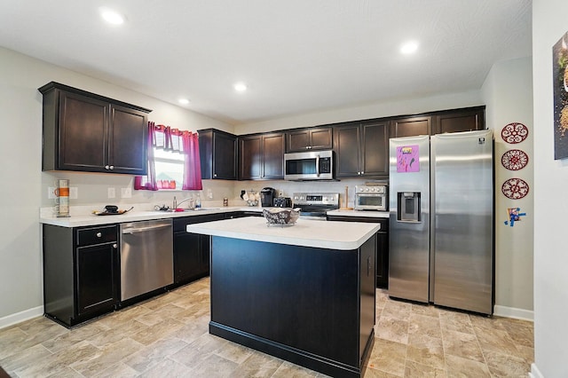 5416 Branchville Dr, Canal Winchester, OH 43110 - kitchen with appliances with stainless steel finishes, a sink, light countertops, baseboards, and recessed lighting