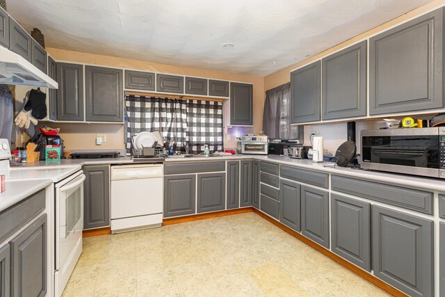 14552 Snyder Rd, Richwood, OH 43344 - kitchen with white appliances, gray cabinetry, a sink, and light countertops