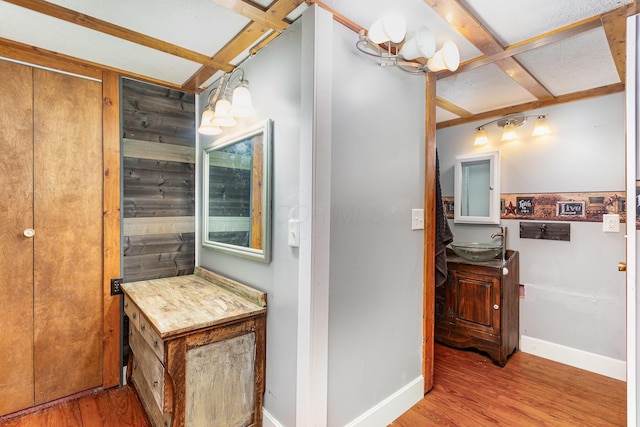 14552 Snyder Rd, Richwood, OH 43344 - bathroom with wood finished floors, baseboards, vanity, and beam ceiling