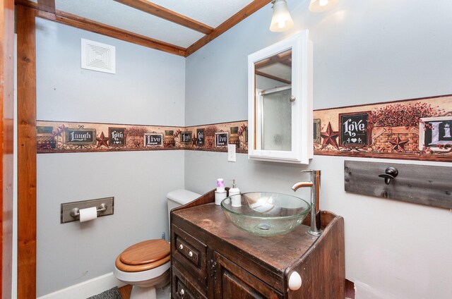 14552 Snyder Rd, Richwood, OH 43344 - bathroom with toilet, vanity, lofted ceiling, and baseboards