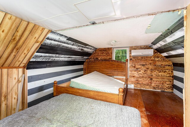 14552 Snyder Rd, Richwood, OH 43344 - bedroom with an AC wall unit, wooden walls, lofted ceiling, and wood-type flooring