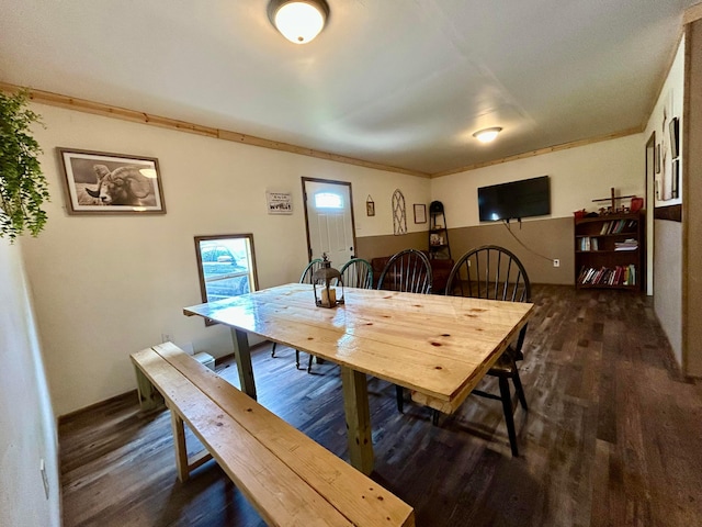 10070 Wolfe Rd, New Vienna, OH 45159 - dining space featuring dark wood-style flooring and ornamental molding