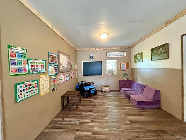 10070 Wolfe Rd, New Vienna, OH 45159 - living area with wood finished floors, ornamental molding, and cooling unit