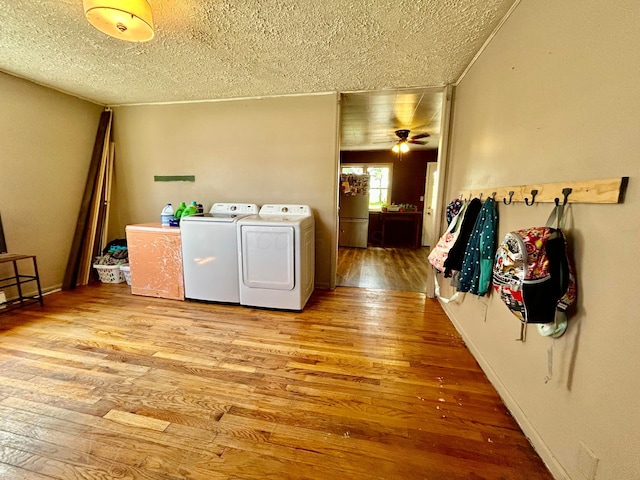 10070 Wolfe Rd, New Vienna, OH 45159 - washroom featuring washer and clothes dryer, a textured ceiling, light wood-type flooring, and ceiling fan