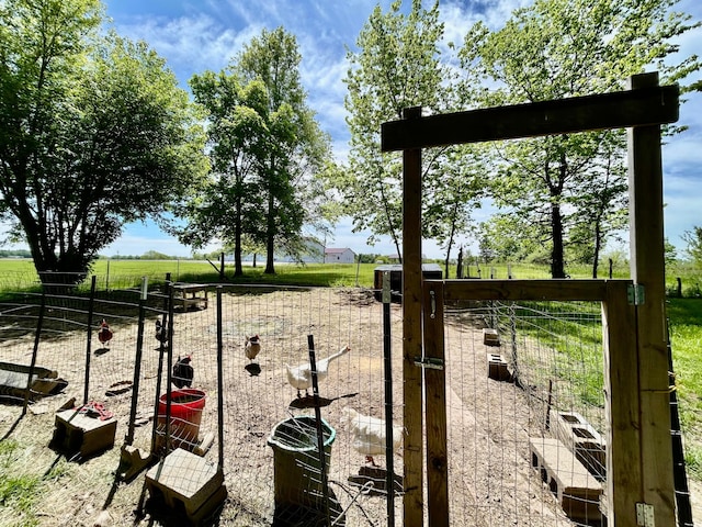 10070 Wolfe Rd, New Vienna, OH 45159 - view of yard featuring exterior structure and a rural view