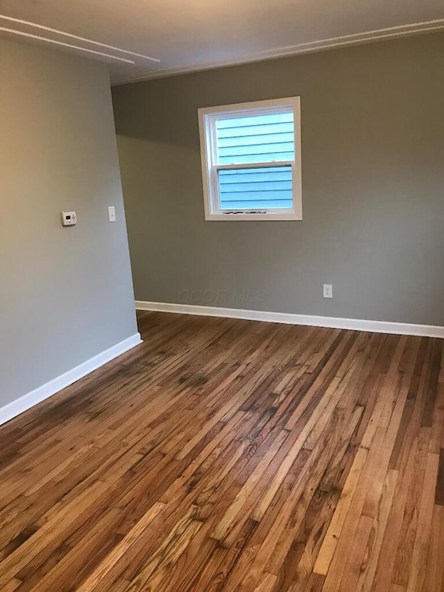 2649 Hiawatha St, Columbus, OH 43211 - unfurnished room featuring dark wood-style flooring and baseboards