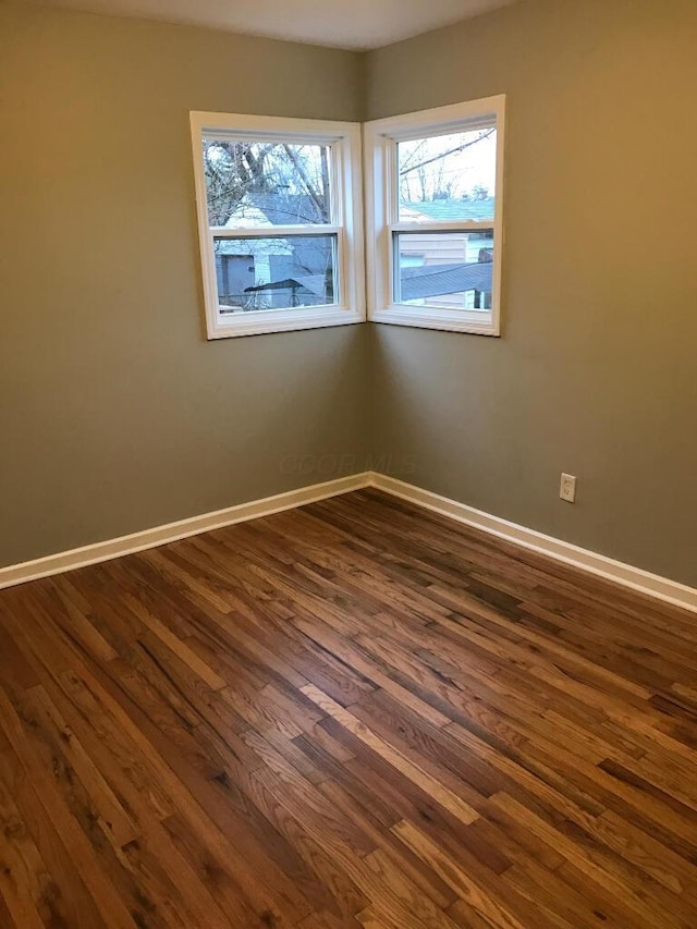2649 Hiawatha St, Columbus, OH 43211 - unfurnished room with dark wood-style floors and baseboards