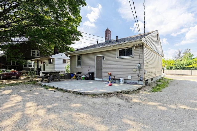 1847 Agler Rd, Columbus, OH 43224 - back of house with a patio area and a chimney
