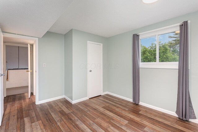 2914 Hickory Hill Dr SE, Lancaster, OH 43130 - unfurnished bedroom featuring hardwood / wood-style floors and baseboards