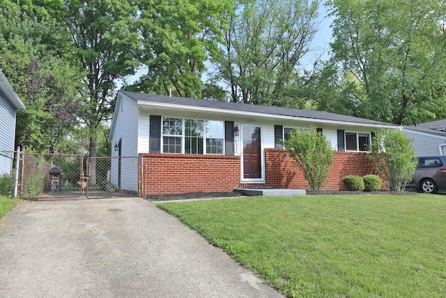 4511 Collingdale Rd, Columbus, OH 43231 - view of front facade with brick siding, a gate, and concrete driveway
