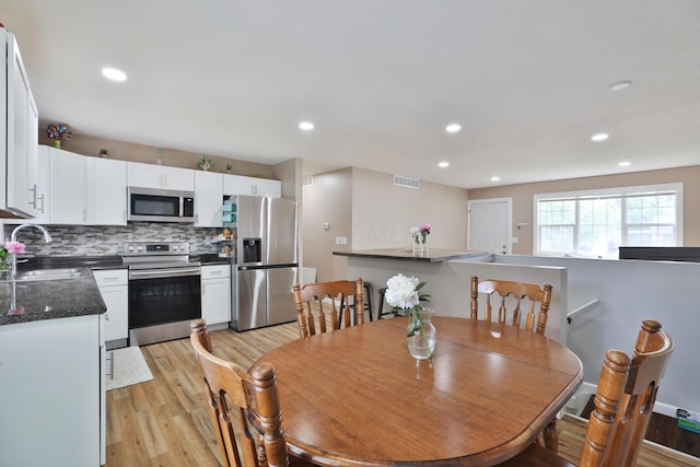4511 Collingdale Rd, Columbus, OH 43231 - dining room with light wood-type flooring and recessed lighting