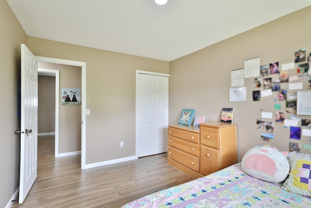 4511 Collingdale Rd, Columbus, OH 43231 - bedroom with light wood-type flooring, baseboards, and a closet