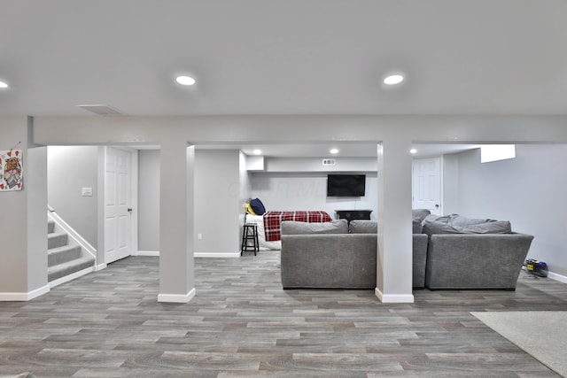 4511 Collingdale Rd, Columbus, OH 43231 - living area featuring baseboards, wood finished floors, recessed lighting, and stairway
