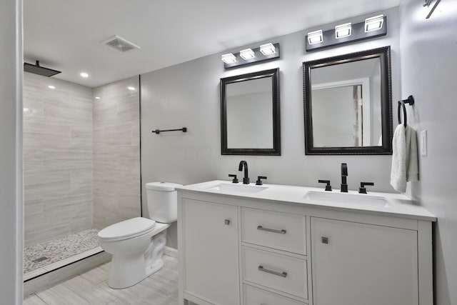 4511 Collingdale Rd, Columbus, OH 43231 - bathroom featuring toilet, double vanity, and tiled shower