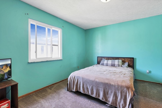 7347 Fall Creek Ln Unit J, Columbus, OH 43235 - bedroom with carpet floors, baseboards, and a textured ceiling